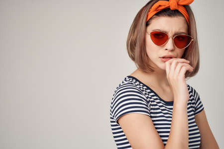 woman in striped t-shirt wearing sunglasses modern fashion cropped viewの写真素材