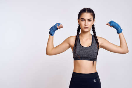athletic brunette in boxing bandages exercise fitness martial artの写真素材