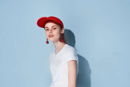 attractive girl in red cap summer clothes fashion posing