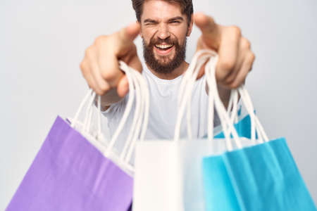 man with bags in his teeth shopping lifestyle funの写真素材
