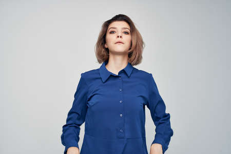 Business woman blue shirts gesturing with hand office professionals workの写真素材