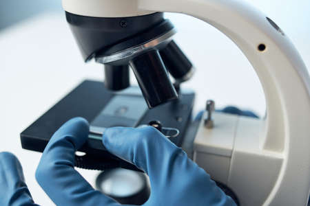 laboratory assistant in a white coat research technology analysis diagnosticsの写真素材