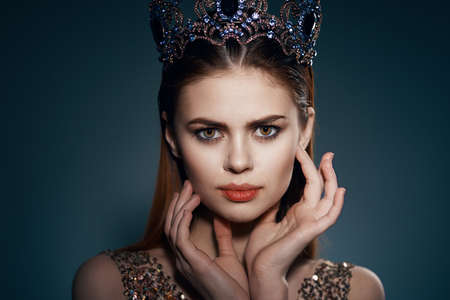 pretty woman with crown on her head princess glamor decoration modelの写真素材