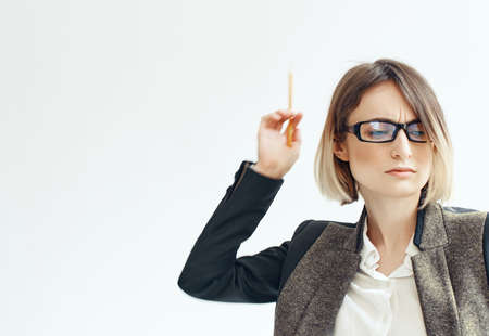 cheerful woman with glasses documents blank form light backgroundの写真素材