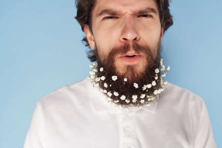 handsome man white shirt stylish hairstyle flowers hairの写真素材