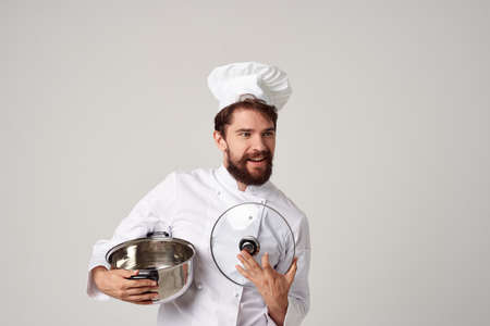 professional chef with a pot in his hands kitchen service professionの写真素材
