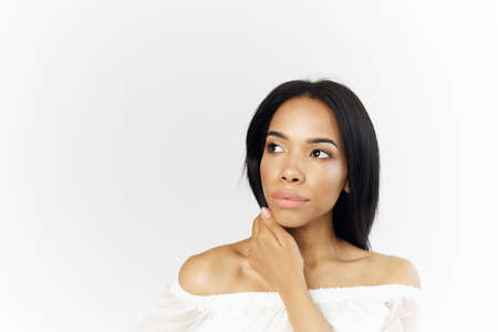 woman of african appearance fashionable hairstyle cosmetics posing closeupの写真素材