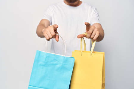 man with solid color bags fashion shopping lifestyle