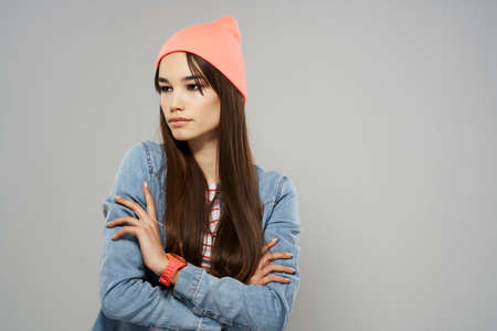 brunette wearing pink hat denim shirt posing fashion hipsterの写真素材