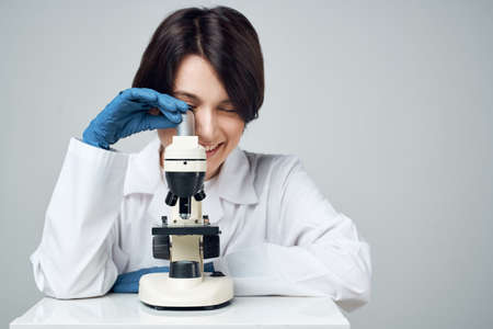 woman scientist laboratory science research microscopeの写真素材