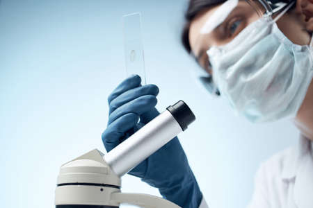 woman laboratory assistant microscope diagnostics research professionals science