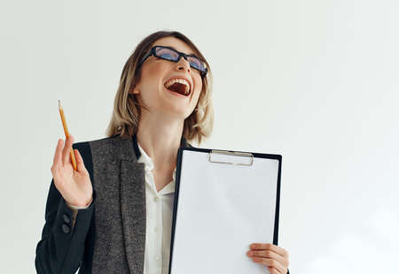 Business woman wearing glasses documents work advertisementの写真素材