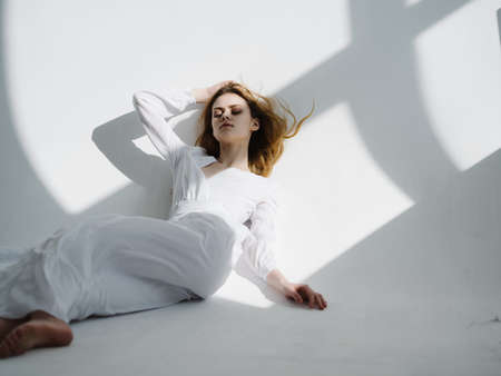 attractive woman in white dress posing isolated background glamor