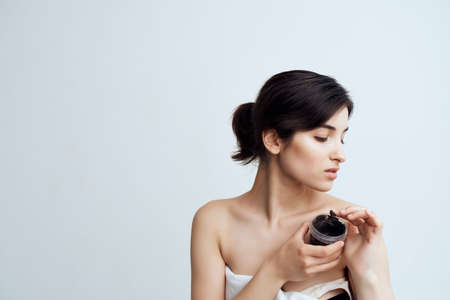 brunette with bare shoulders clear skin spa treatmentsの写真素材