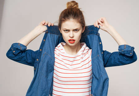 young woman in fashionable clothes fun backpack schoolの写真素材