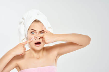 woman with bare shoulders facial skin care acne dermatology close-upの写真素材