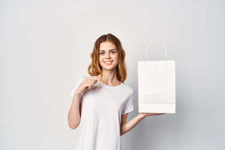 pretty woman with package in her hands mockup shopping