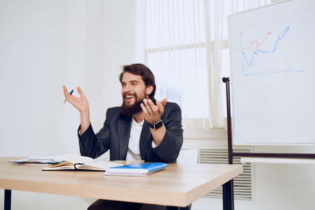 business man sitting at his desk office finance work