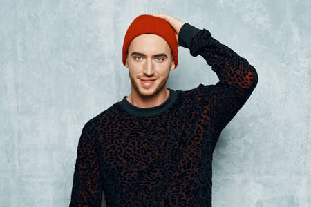 handsome short haired man fashion black sweater posing Studioの写真素材