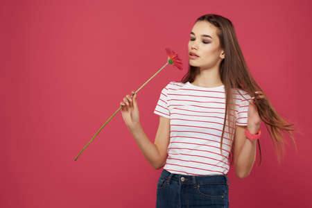 cute girl with red flower striped t-shirt cropped look luxuryの写真素材