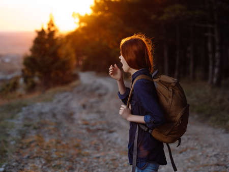 woman with backpack on nature walk vacation mountainsの写真素材
