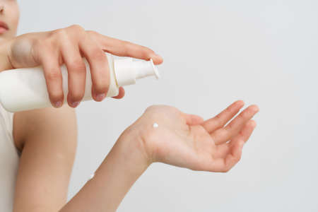 woman applying cream on hand clean skin health moisturizing