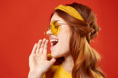 cheerful woman in yellow glasses fashion jewelry hippie