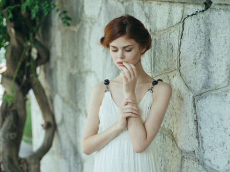 Woman in white dress outdoors in Greece decorationの写真素材