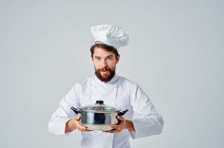 bearded male chef with saucepan in hands kitchen restaurant professionalの写真素材