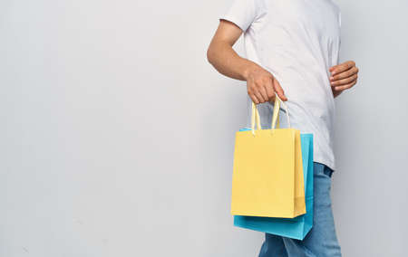 bags in the hands of a man sale shopping