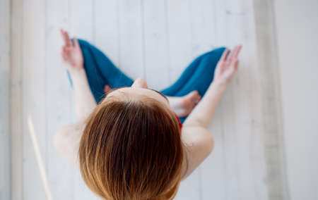 woman meditating in lotus position yoga rest