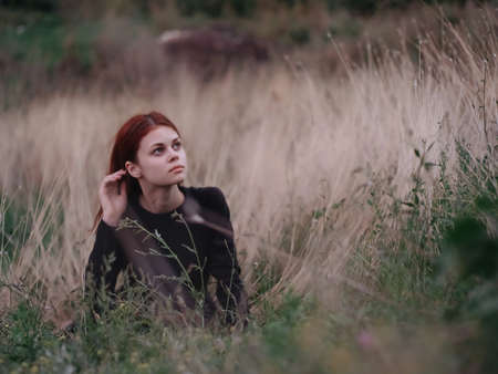 woman lies on the grass in the field nature freedom restの写真素材