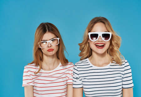 two girlfriends in striped t-shirts fashionable glasses summer friendship