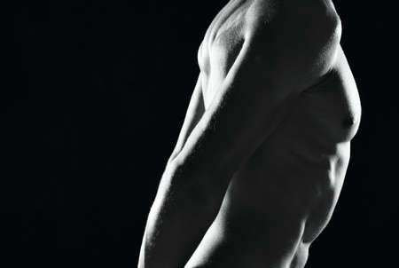 a man in black panties an inflated body black and white photo fitnessの写真素材