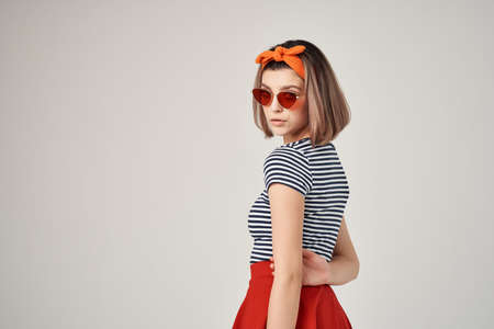 woman in striped t-shirt with bandage on her head wearing sunglasses fashion summerの写真素材