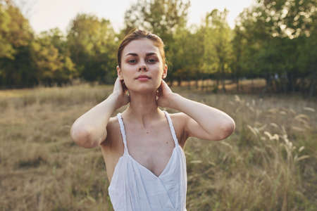 pretty woman outdoors in the field freedom leisure lifestyle