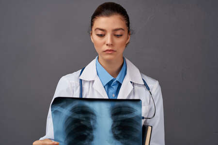 female doctor medicine diagnosis by x-ray examinationの写真素材