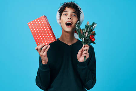 curly guy in a Santa hat gift holiday New Yearの写真素材