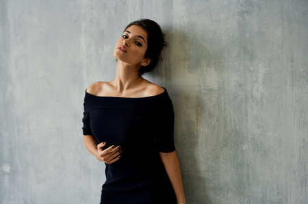 Woman in black dress posing decoration elegant style modelの写真素材