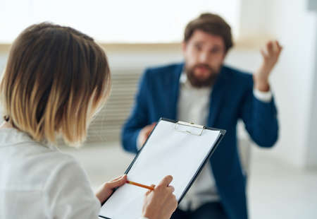 woman consults man psychology depression communication workの写真素材