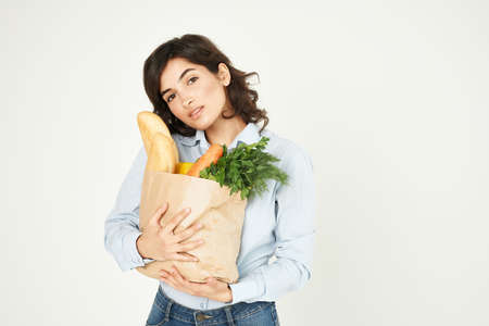 woman with a package of groceries shopping healthy food delivery toの写真素材