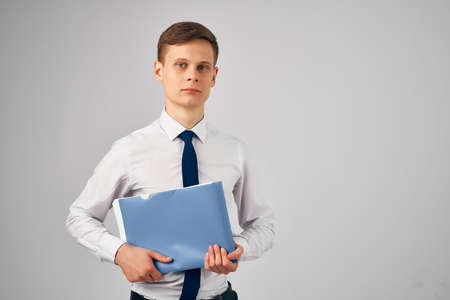 business man in shirt with tie blue folder documents work officialの写真素材
