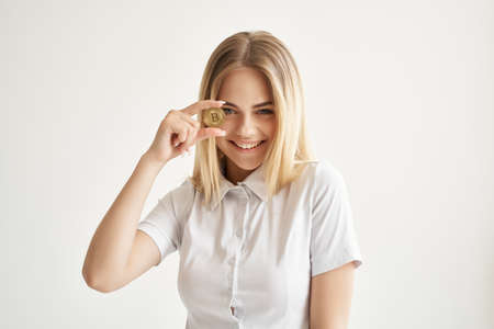 woman in white shirt smile cryptocurrency technologyの写真素材