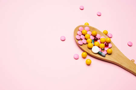 colorful medicine lice pink background medicine pain reliever medicationの写真素材