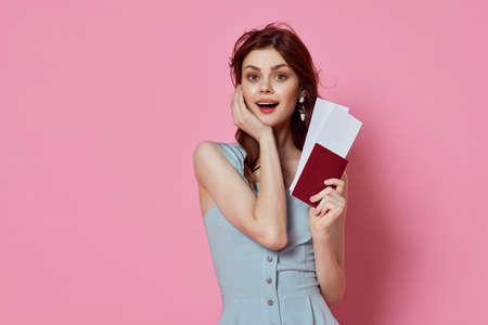 cheerful woman with passport and plane tickets travel lifestyle