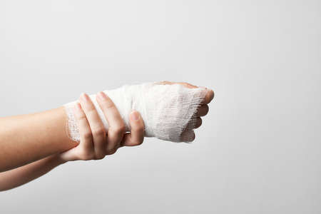injured arm treatment pain close-up bandage