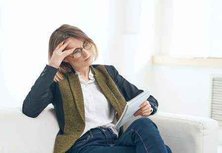 Business woman sitting in chair working office professional documents