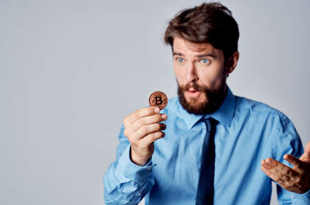 man in a shirt with a tie emotions cryptocurrency finance electronic walletの写真素材