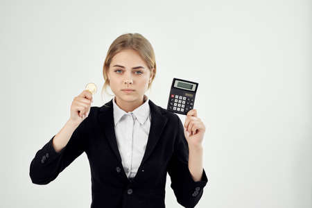 Business woman with calculator cryptocurrency Bitcoin finance e-commerce