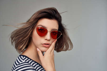 pretty blonde wearing sunglasses face close up posing
